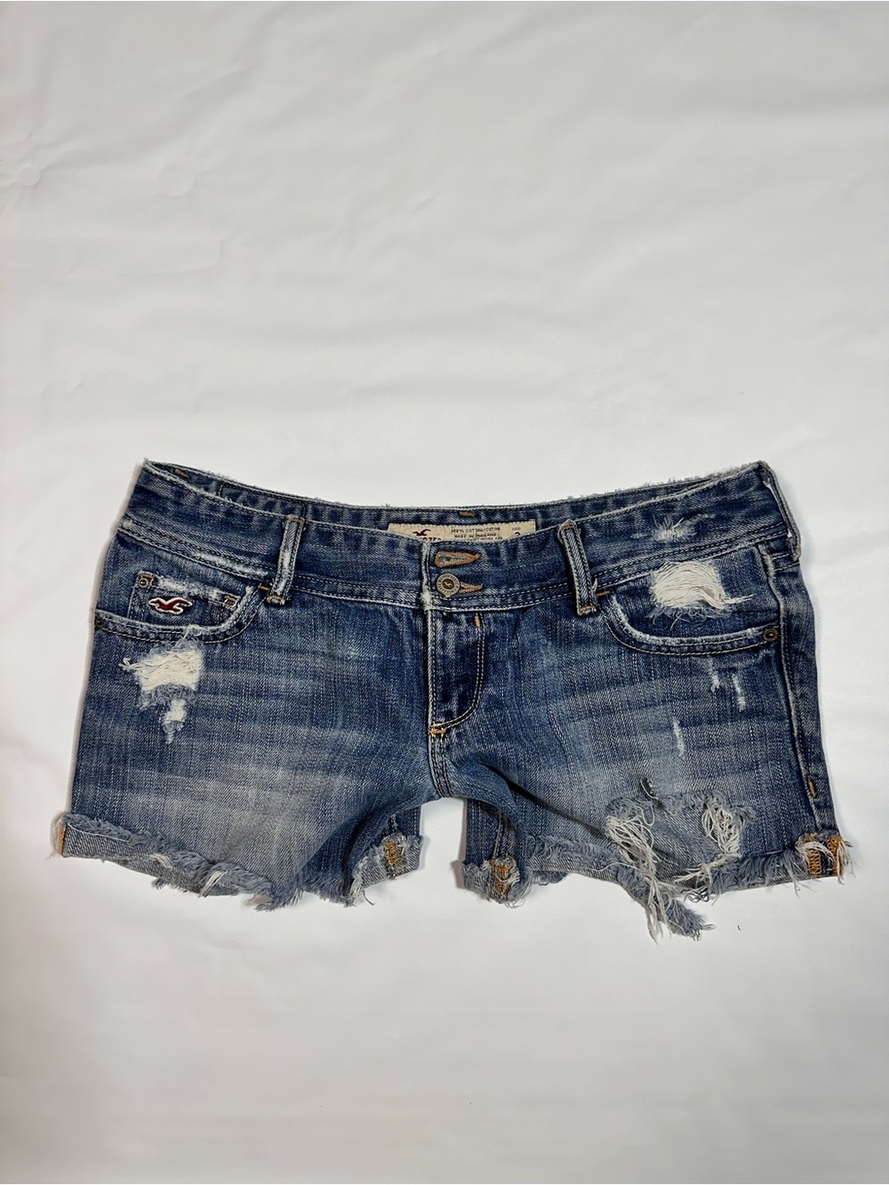 Hollister Frayed Distressed Denim Cutoff Shorts in Blue Wash